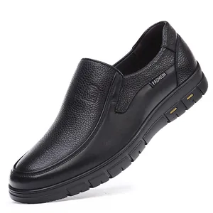 Detailed side view of premium black textured leather slip-on loafers with non-slip sole