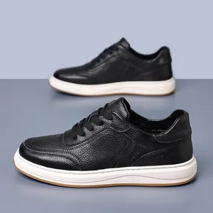 Side view detail of black genuine cowhide leather men's casual sneakers with white sole