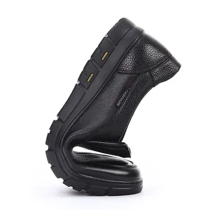 Detailed view of flexible black leather men's loafers showing soft bendable sole texture