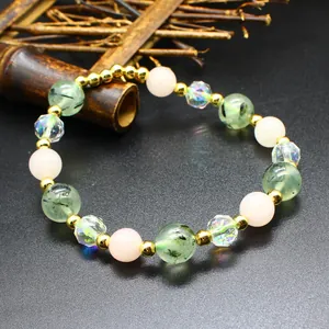 Detailed macro view of a handmade natural stone bracelet with green and pink beads
