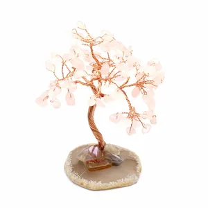 Miniature rose quartz crystal tree with wire wrapped trunk on agate slice base