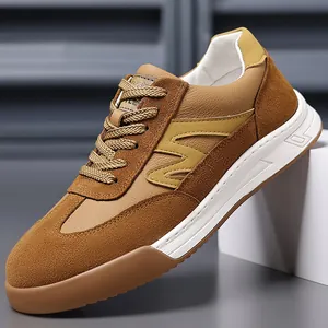 Close-up of men's retro German Army Trainers with brown suede and leather texture detail.