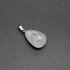 Close-up of a teardrop-shaped clear white natural stone pendant with a silver metal bail.