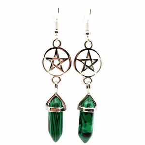 Detailed macro shot of green malachite stone hexagonal pillar earrings with pentagram