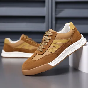 Retro brown men's German Army Trainer sneakers with thick white soles and suede panels