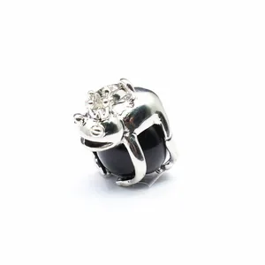 Detailed view of silver-tone frog prince pendant holding a polished black stone ball.