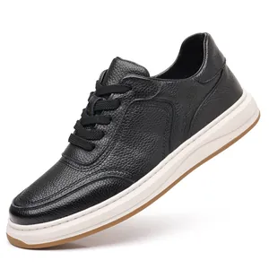 Side view of men's black pebbled leather casual shoe with white sole.