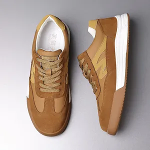 Detailed view of men's vintage brown GAT sneakers with suede and leather panels