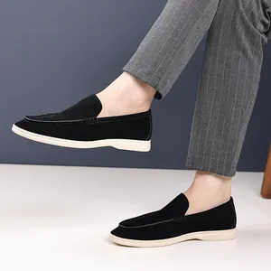Detailed view of men's black suede loafers with comfortable slip-on design
