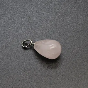 Close-up of a pink teardrop strawberry quartz crystal pendant with a polished silver bail