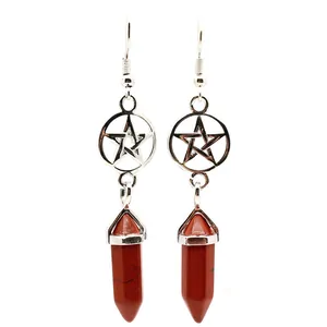 Close-up detail of silver pentagram earrings with natural red jasper hexagonal pillar.