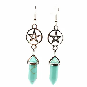 Close-up detail of the turquoise stone hexagonal pendant earrings with pentagram charms.