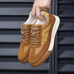 Close-up of brown suede and leather men's vintage German Army Trainers with thick soles