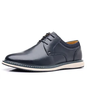Navy blue men's leather derby shoe with contrast stitching and cream sole detail view