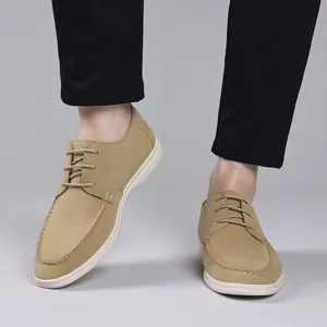 Men's beige suede loafers with white soles and lace-up design for casual wear style