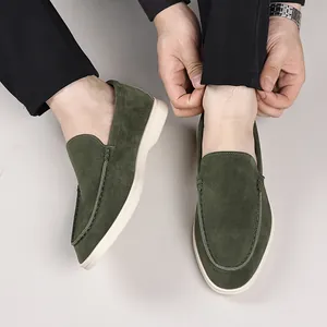 Macro view of stylish men's green suede loafers slip-on casual driving shoes