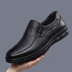 Close-up of black genuine leather men's slip-on shoe showing grain texture