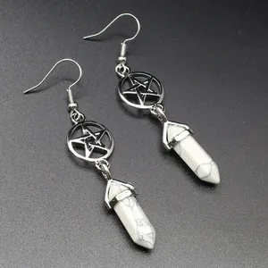 Detailed view of silver pentagram earrings featuring white howlite hexagonal pillar drops