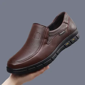 Close-up of premium brown leather men's slip-on shoes with textured grain finish