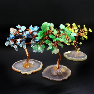 Handmade wire-wrapped chakra crystal trees featuring natural colorful agate slice bases