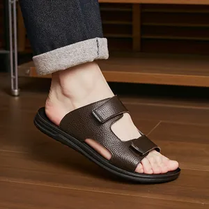 Detail of men's brown leather non-slip slides with adjustable straps for summer.