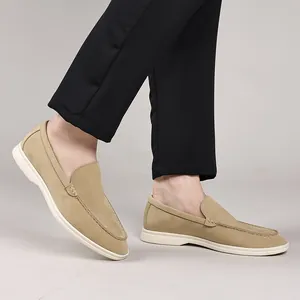 Detailed side view of stylish khaki men's breathable slip-on loafers with white soles