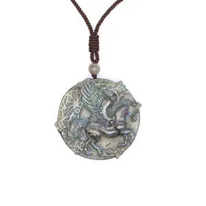 Macro detail of hand-carved flying horse on natural blue-sheen Labradorite stone pendant