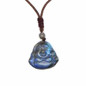 Macro detail of hand-carved natural blue labradorite laughing Buddha pendant necklace