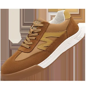 Vintage men's brown suede German Army trainers with thick rubber soles and lace-up closure
