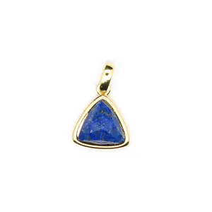 Close-up of a delicate triangular faceted lapis lazuli pendant in gold plating.