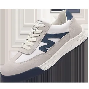 Retro men's German Army Trainers in white and grey suede with navy accents and thick soles.