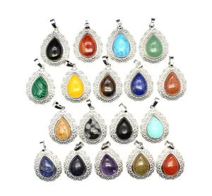 Selection of teardrop-shaped natural stone pendants with ornate filigree silver frames
