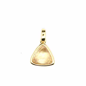 Close-up of a delicate triangular faceted natural stone pendant with gold bezel