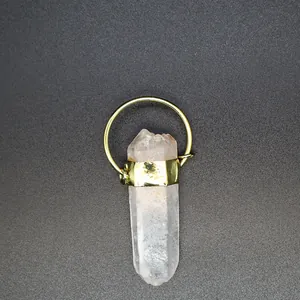 Detailed view of a raw crystal quartz pendant featuring a polished gold metal ring