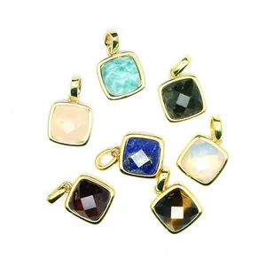 Detail view of seven assorted cushion-cut natural stone pendants with gold-plated frames