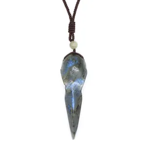 Hand-carved labradorite bird skull pendant with blue flash for meditation.