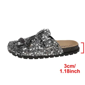 Detailed macro view of silver sequin mule clog focusing on the 3cm platform heel height info