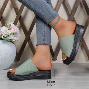 Detail of women's platform slide sandals showing 4.5cm heel height and ribbed fabric