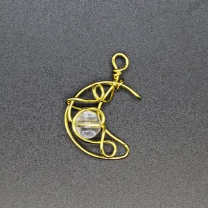 Exquisite handmade gold wire wrapped crescent moon pendant featuring a clear crystal bead