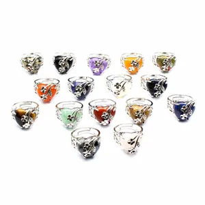 Collection of various natural stone heart rings with delicate silver flower details