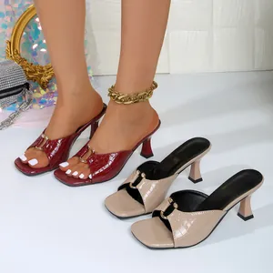 Detail view of square toe high heel sandals with crocodile pattern and stylish metal decor