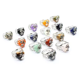 Assorted heart-shaped natural stone rings with floral silver-plated adjustable bands.