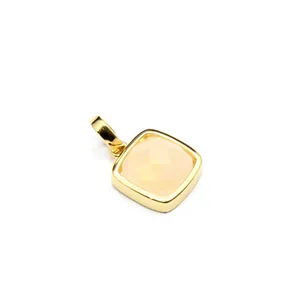 Close-up of elegant square faceted natural stone pendant in a gold-plated bezel setting