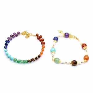 Detailed view of two handmade chakra gemstone bracelets with 14K gold filled accents