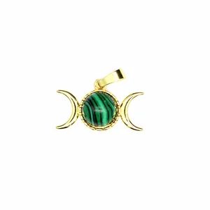 Detailed macro shot of 24K gold plated malachite triple moon goddess jewelry pendant