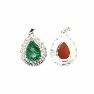 Detail view of water-drop stone pendant showing front and back with lace silver border