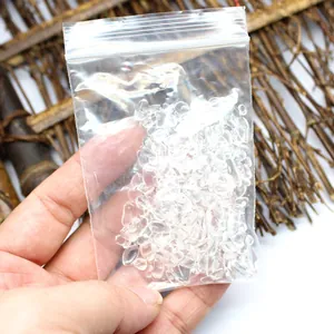 Natural clear quartz crystal chips inside a small transparent plastic zip-lock bag