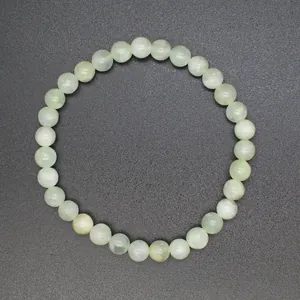 Top view of natural light green stone beaded bracelet with 6mm round beads.