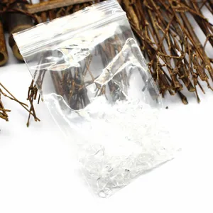 Detail of clear white crystal purification crushed stones in a small zip-lock bag