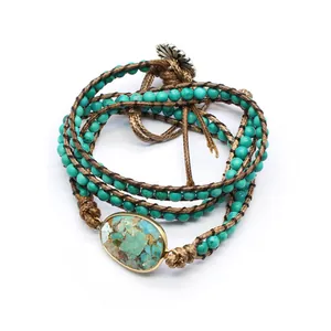 Handmade turquoise beaded wrap bracelet with natural oval stone pendant detail view